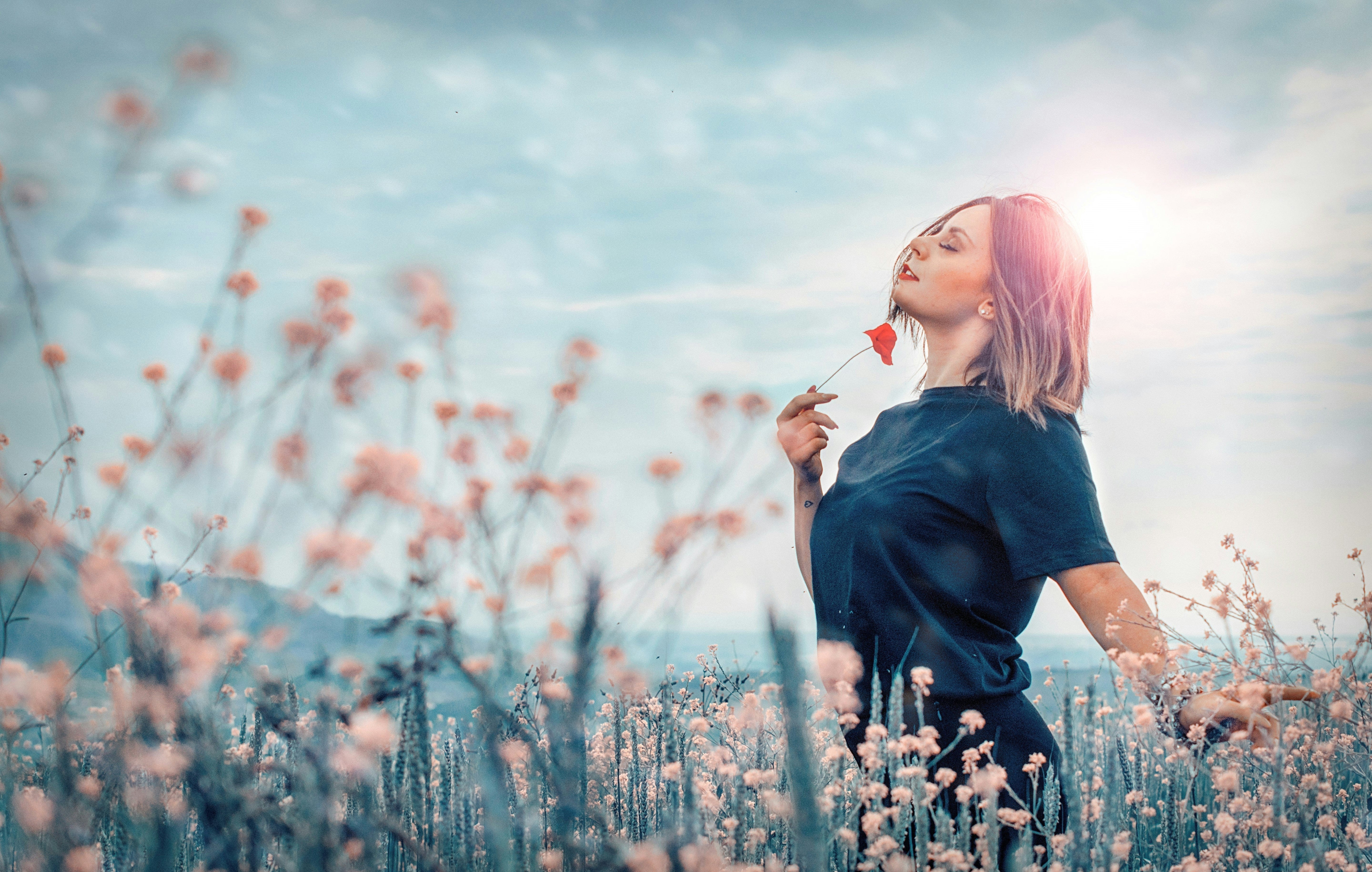 Woman enjoying a field of flowers
