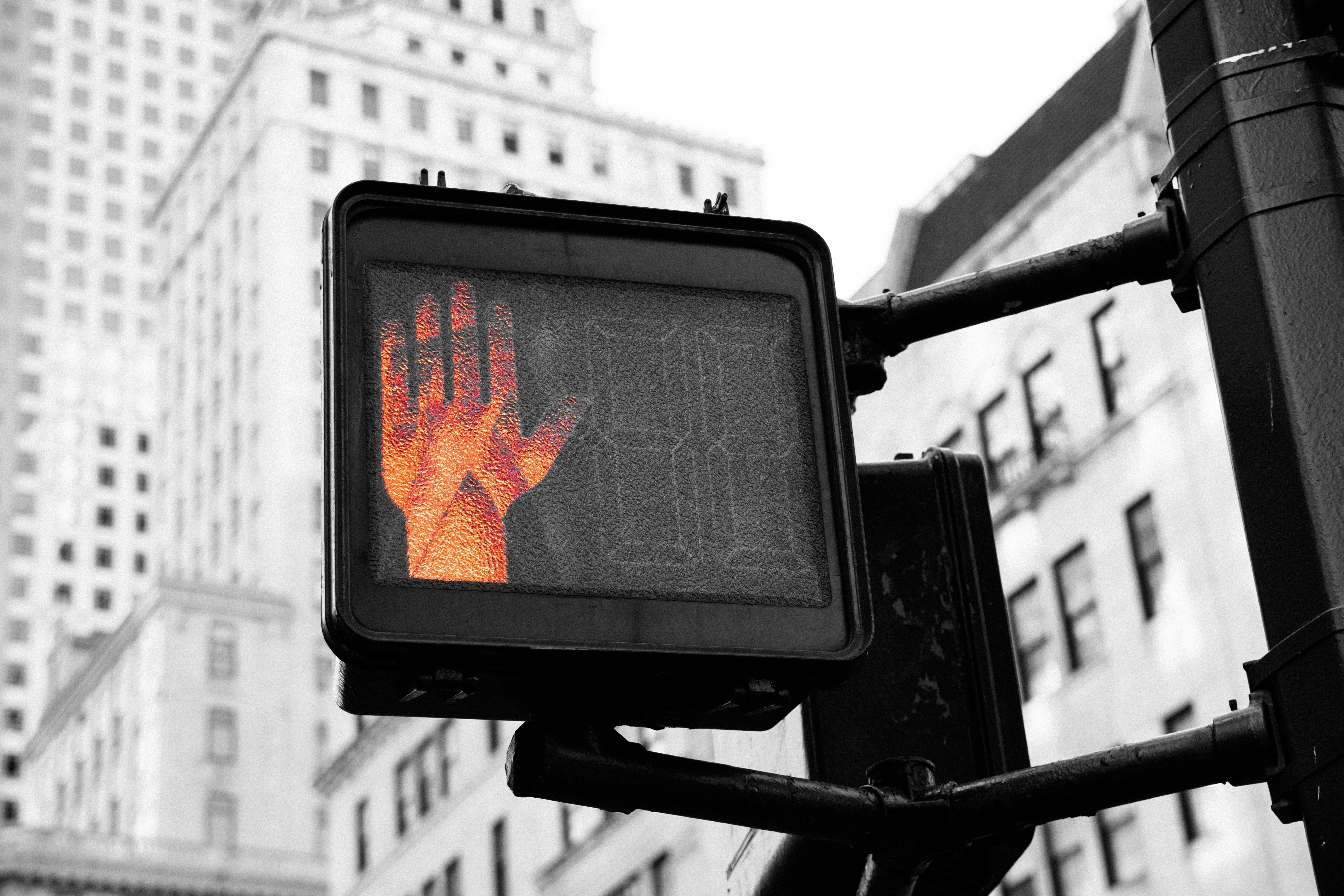 Red street light in the shape of a hand
