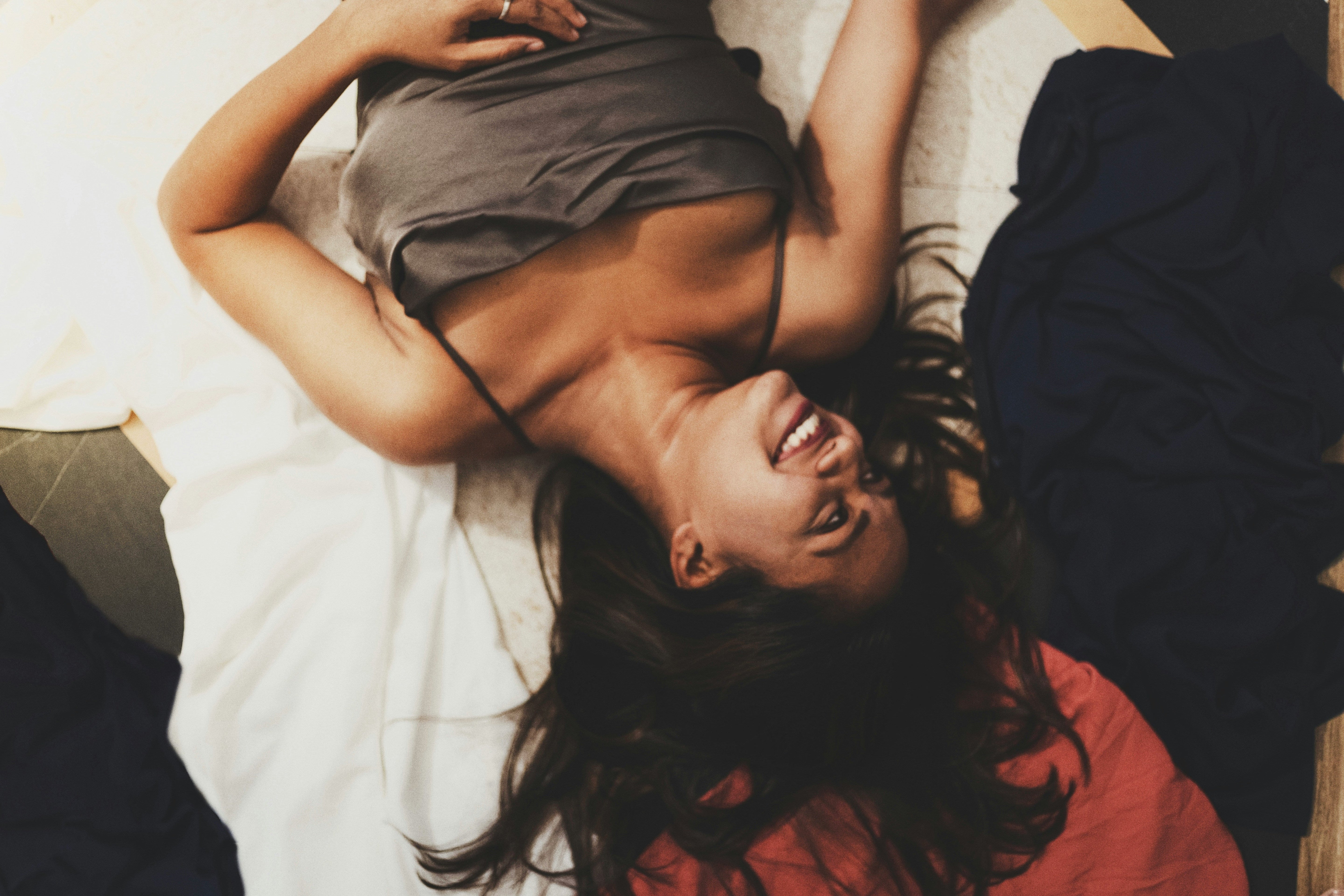 Woman relaxed and smiling on the bed