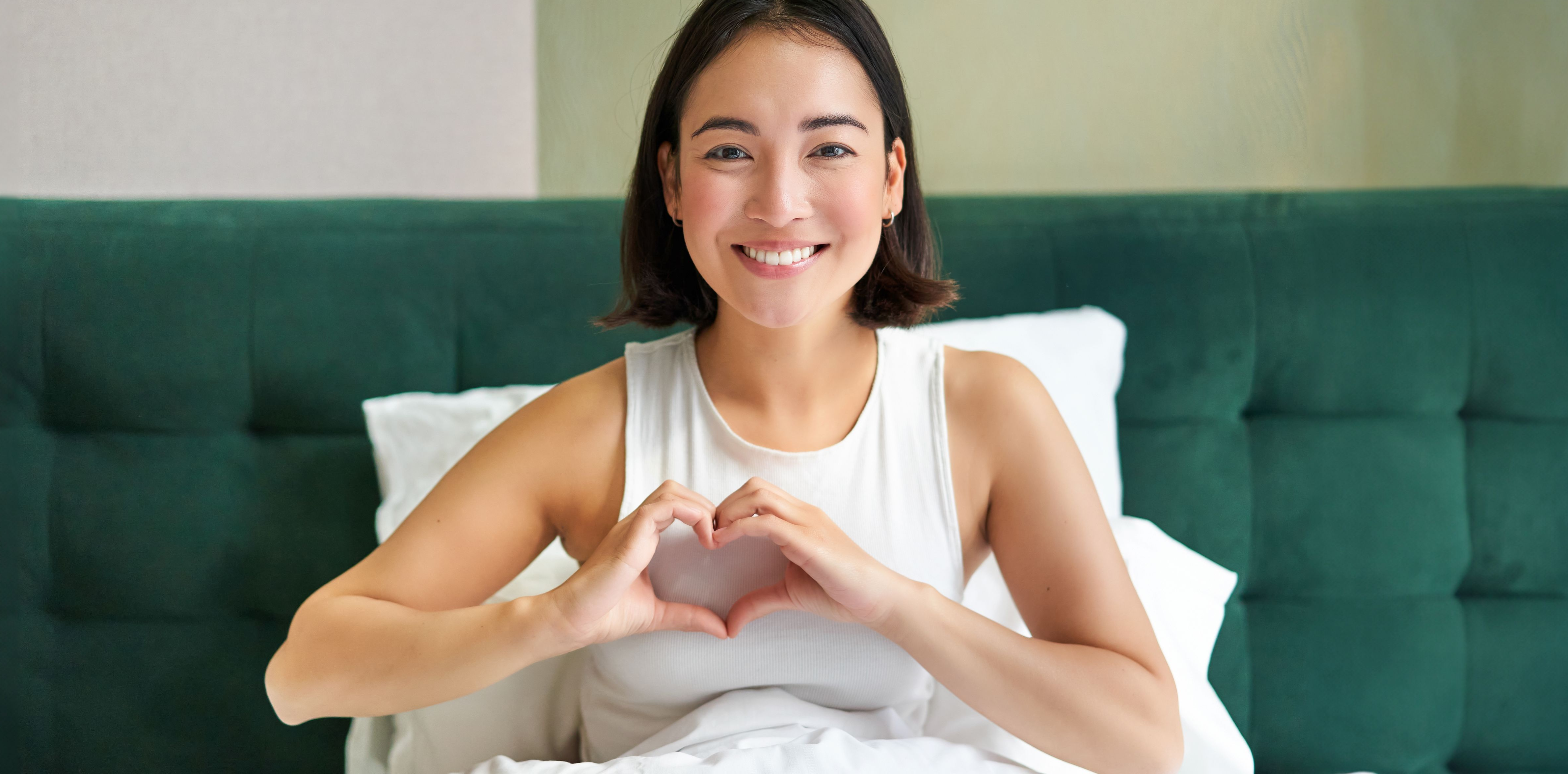 Woman forming a heart with her hands
